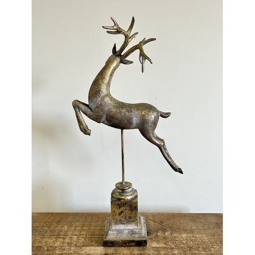 225 - A resin model of a leaping deer, approx. 22
