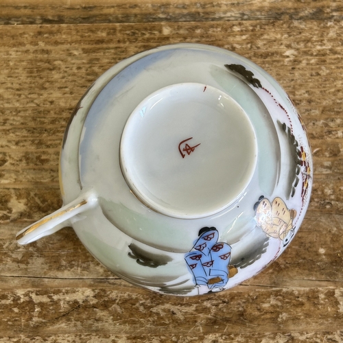 23 - A vintage Japanese porcelain tea set with hand painted decoration in a 12 setting including a teapot... 