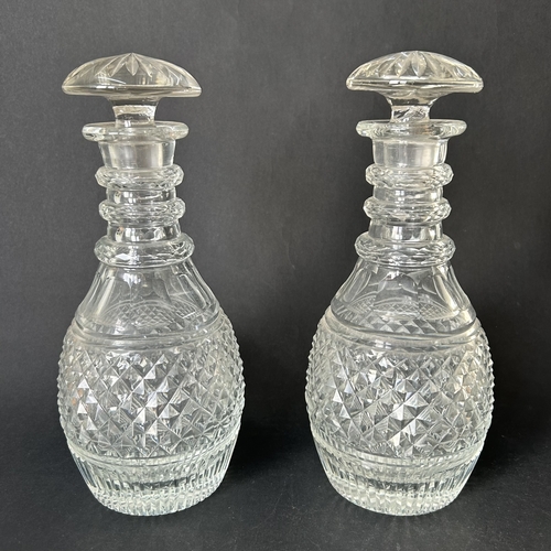 240 - A pair of 19th Century hand blown and cut glass decanters with mushroom stoppers, approx. 10 1/4
