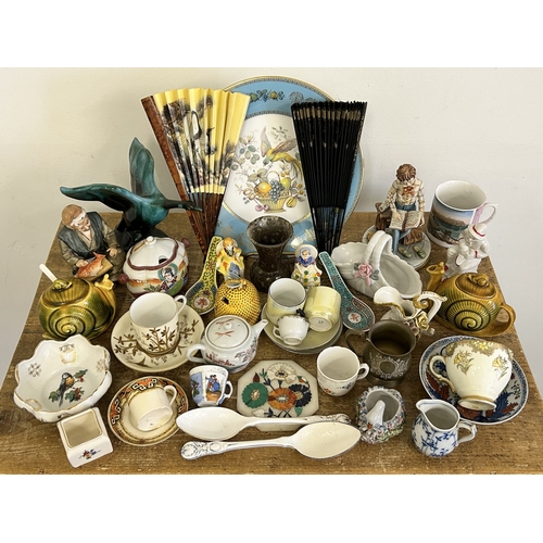 246 - A box of mixed mainly ceramics including figurines, cups and saucers, fans etc