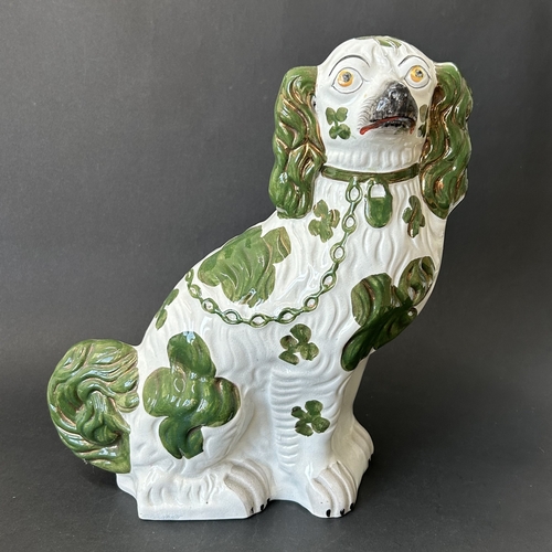 261 - A Staffordshire green pattern dog, approx. 12