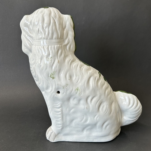 261 - A Staffordshire green pattern dog, approx. 12