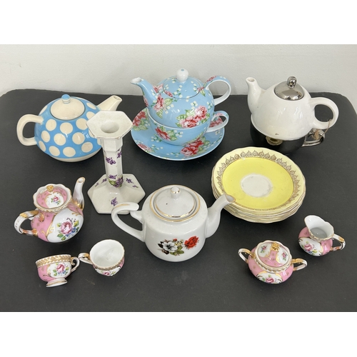273 - Various teapots, tea cups and saucers, candlestick etc