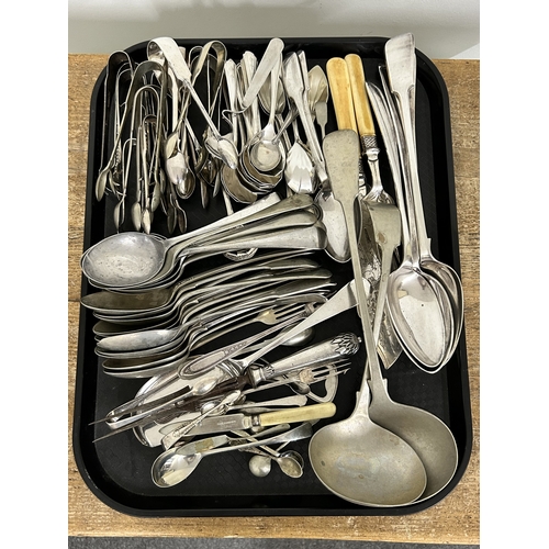 278 - A large collection of vintage silver plated cutlery and servers including four stuffing spoons, tong... 