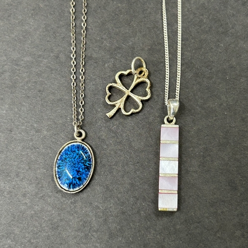 308 - A sterling silver blue stone locket on chain together with a sterling chain with pendant, a 925 four... 