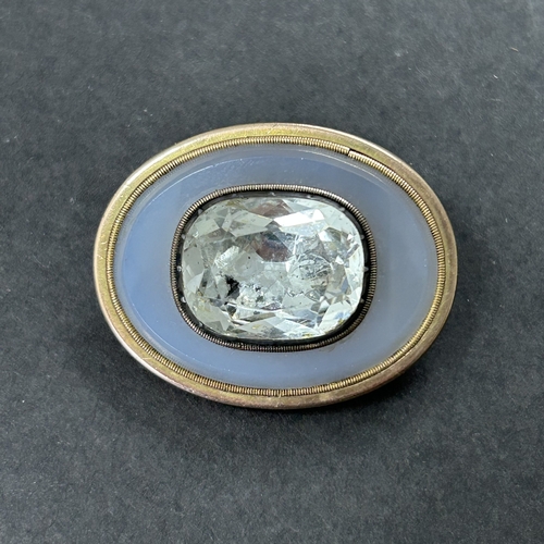 324 - An antique gold plated white stone and glass brooch, possibly converted from a different piece
