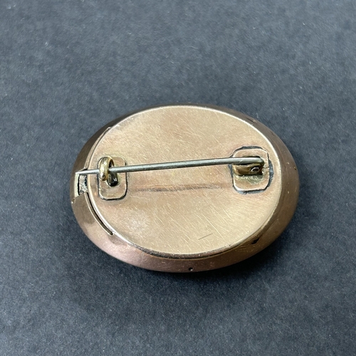 324 - An antique gold plated white stone and glass brooch, possibly converted from a different piece