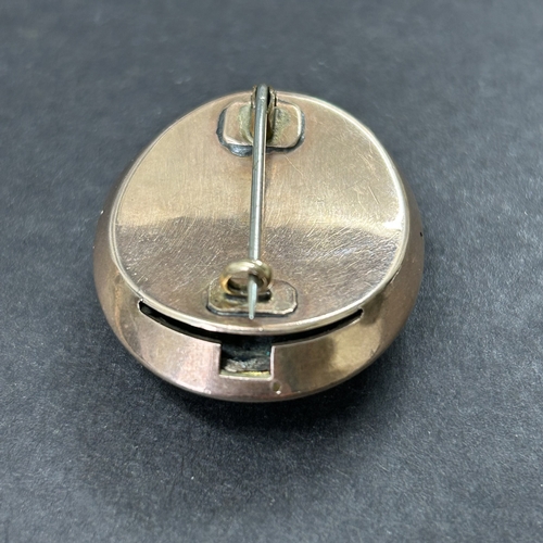 324 - An antique gold plated white stone and glass brooch, possibly converted from a different piece