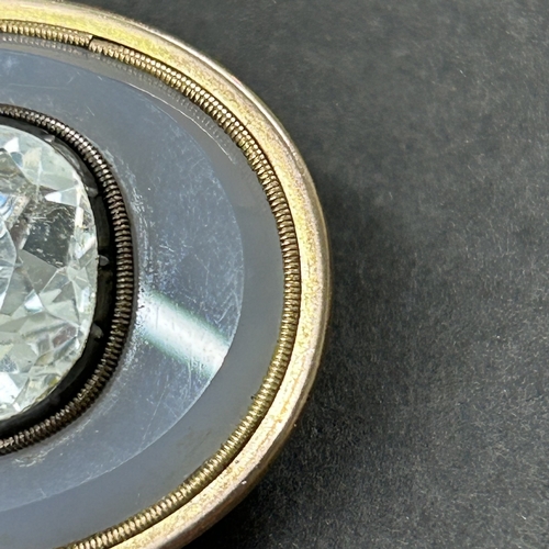 324 - An antique gold plated white stone and glass brooch, possibly converted from a different piece