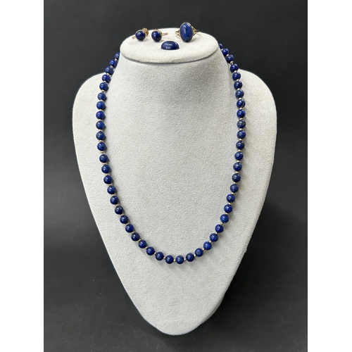 325 - A 9ct gold lapis lazuli stone set ring, approx. size O 1/2, weight approx. 4g together with a matchi... 