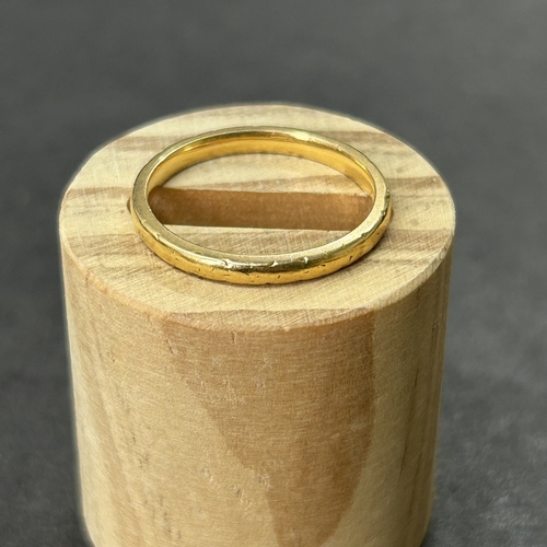 342 - A 22ct gold wedding band, approx. size M, weight approx. 2.7g (edge knocks)