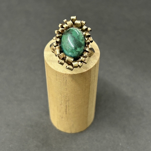 344 - An unusually constructed ring, the shank marked for 9ct white gold, the top with scrolls of yellow m... 