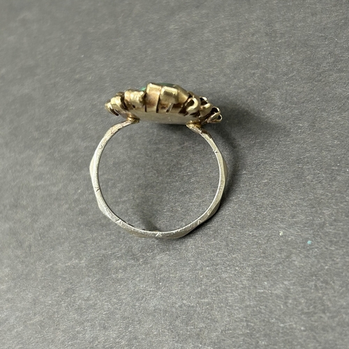 344 - An unusually constructed ring, the shank marked for 9ct white gold, the top with scrolls of yellow m... 