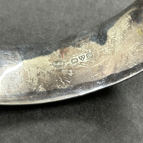 362 - A Chester hallmarked silver bangle, weight approx. 25g (safety chain as found, a few shallow dents)
