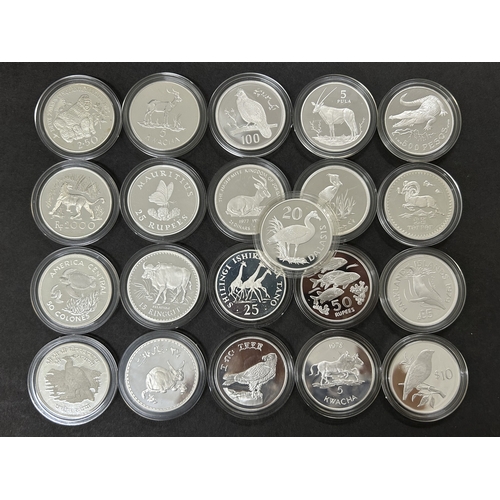 364 - Twenty one encapsulated silver coins, all date mid 1970's, in 1974 many worldwide countries in conju... 