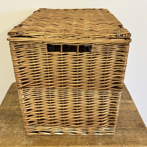 46 - A wicker lidded box stencilled 'F & M' to the front, approx. 16 1/2