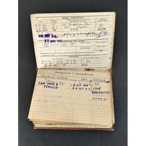 50 - A collection of WW2 era one mans medals, service and release book, a small amount of insignia etc an... 