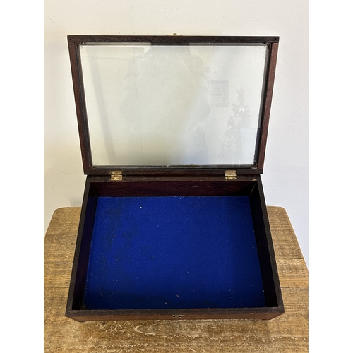 62 - A wooden table top display cabinet with blue baize, 16 3/4