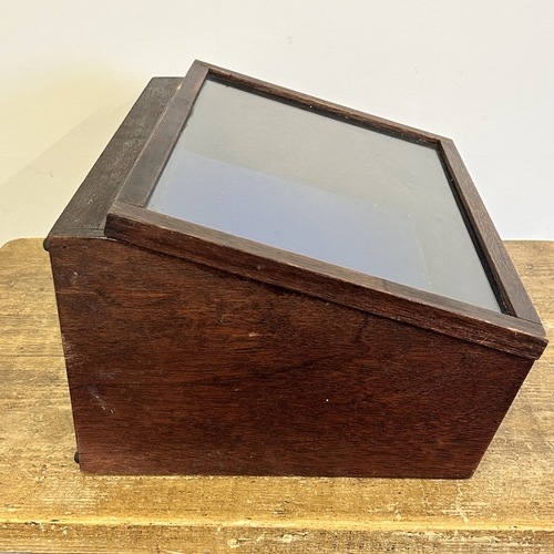 62 - A wooden table top display cabinet with blue baize, 16 3/4