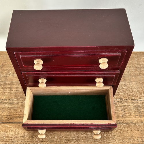 67 - A miniature wooden three drawer jewellery/collectors chest, mahogany stained, approx. 9 1/4