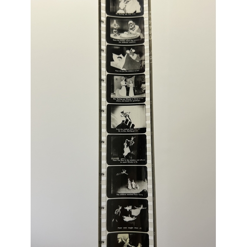 89 - A vintage Dumbo box with 'film strips' of short rolls of film including Disney Peter Pan, 1960 Royal... 