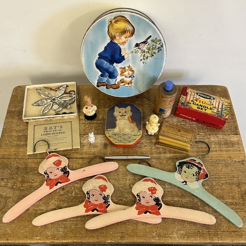 91 - A collection of vintage items including tins, Price's candle set, clothes hangers etc