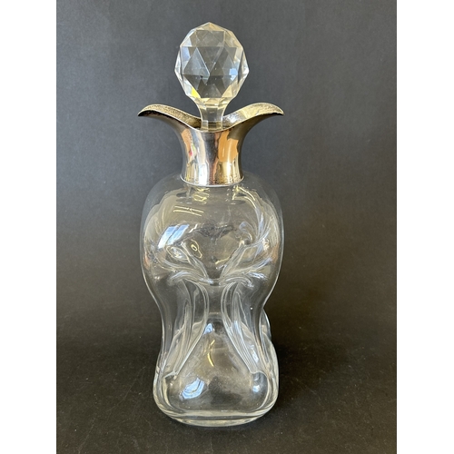 99 - A decorative hallmarked silver and blown glass 'glug glug' decanter, either London 1897 or 1903 (dat... 