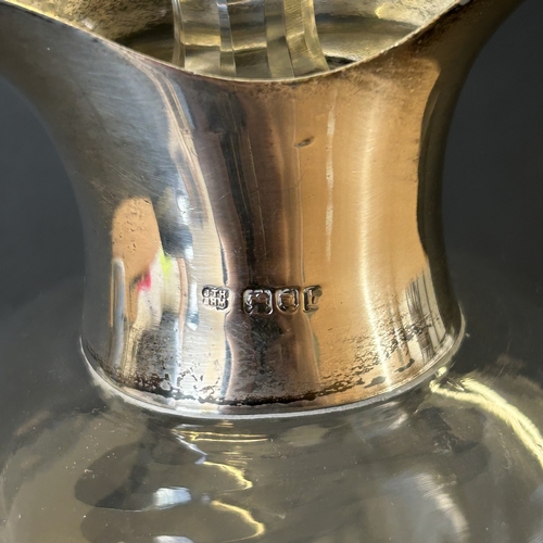 99 - A decorative hallmarked silver and blown glass 'glug glug' decanter, either London 1897 or 1903 (dat... 