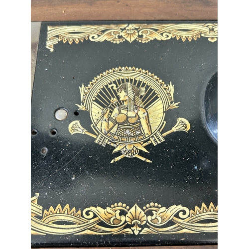 410 - An antique wood cased Frister & Rossmann manual sewing machine with gilded Egyptian decoration (box ... 