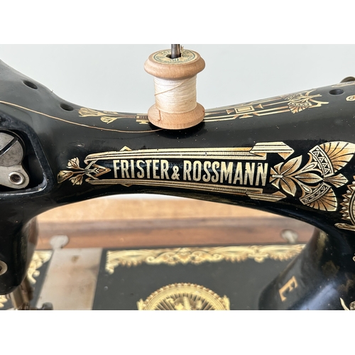 478 - An antique wood cased Frister & Rossmann manual sewing machine with gilded Egyptian decoration (box ... 