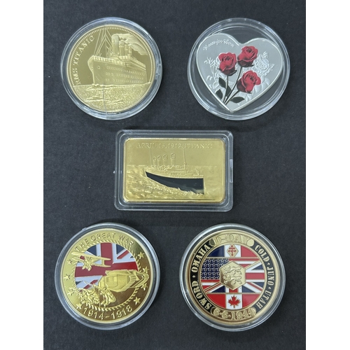 104 - Four collectors commemorative coins including Titanic, WW1, WW2 and a love heart