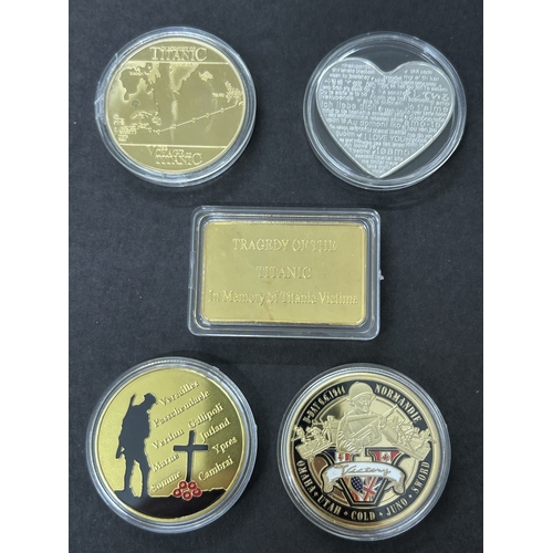 104 - Four collectors commemorative coins including Titanic, WW1, WW2 and a love heart