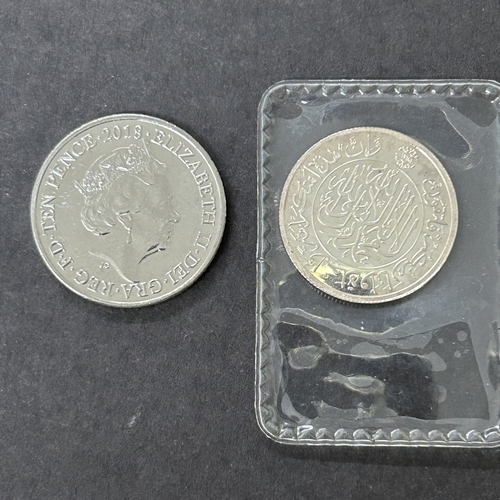 106 - A 'Government of Kelantan' one dirham 999.0 silver fantasy coin, weight approx. 3.5g together with a... 