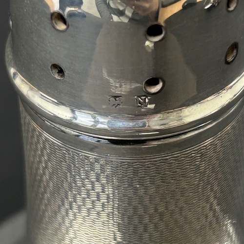 185 - A hallmarked silver sugar caster, Birmingham 1937, this contains a Bakelite lined interior in the ba... 