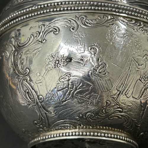 187 - An antique German 800 grade silver repousse lidded bowl or tea caddy, decorated with classical figur... 