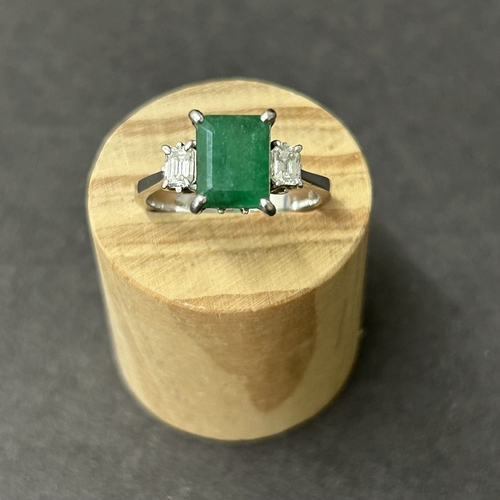 198 - A 750 (18ct) white diamond and green stone set ring, approx. size O, weight approx. 3.7g