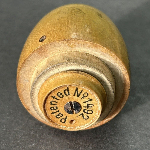 199 - A Victorian treen 'The Columbian Egg' needle case from the 'Worlds Columbian Exposition', German mad... 