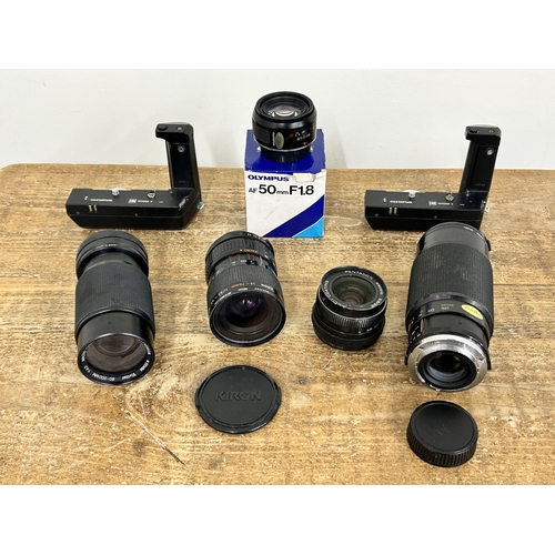 219 - Two vintage Olympus Power Winders plus five 35mm camera lenses (all untested and in used condition)