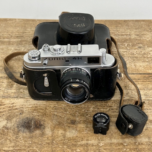 221 - A vintage Zorki-4 35mm camera with a Jupiter 2-50 lens in original case plus a rangefinder (all unte... 