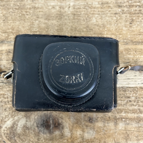 221 - A vintage Zorki-4 35mm camera with a Jupiter 2-50 lens in original case plus a rangefinder (all unte... 