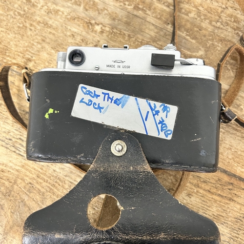 221 - A vintage Zorki-4 35mm camera with a Jupiter 2-50 lens in original case plus a rangefinder (all unte... 