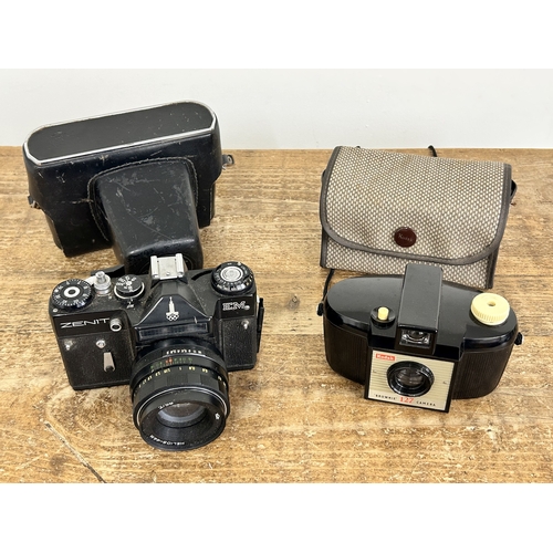 225 - A Zenit EM 35mm camera plus a Kodak Brownie 127 camera (all untested and in used condition)