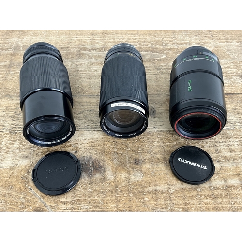 226 - Three 35mm SLR camera lenses to include two Olympus 35-200, a 70-210 and a Canon 70-210 (used condit... 