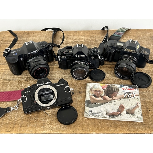 232 - Four vintage 35mm SLR cameras to including a Praktica BC1 (body only), an Olympus OM101, a Canon T70... 