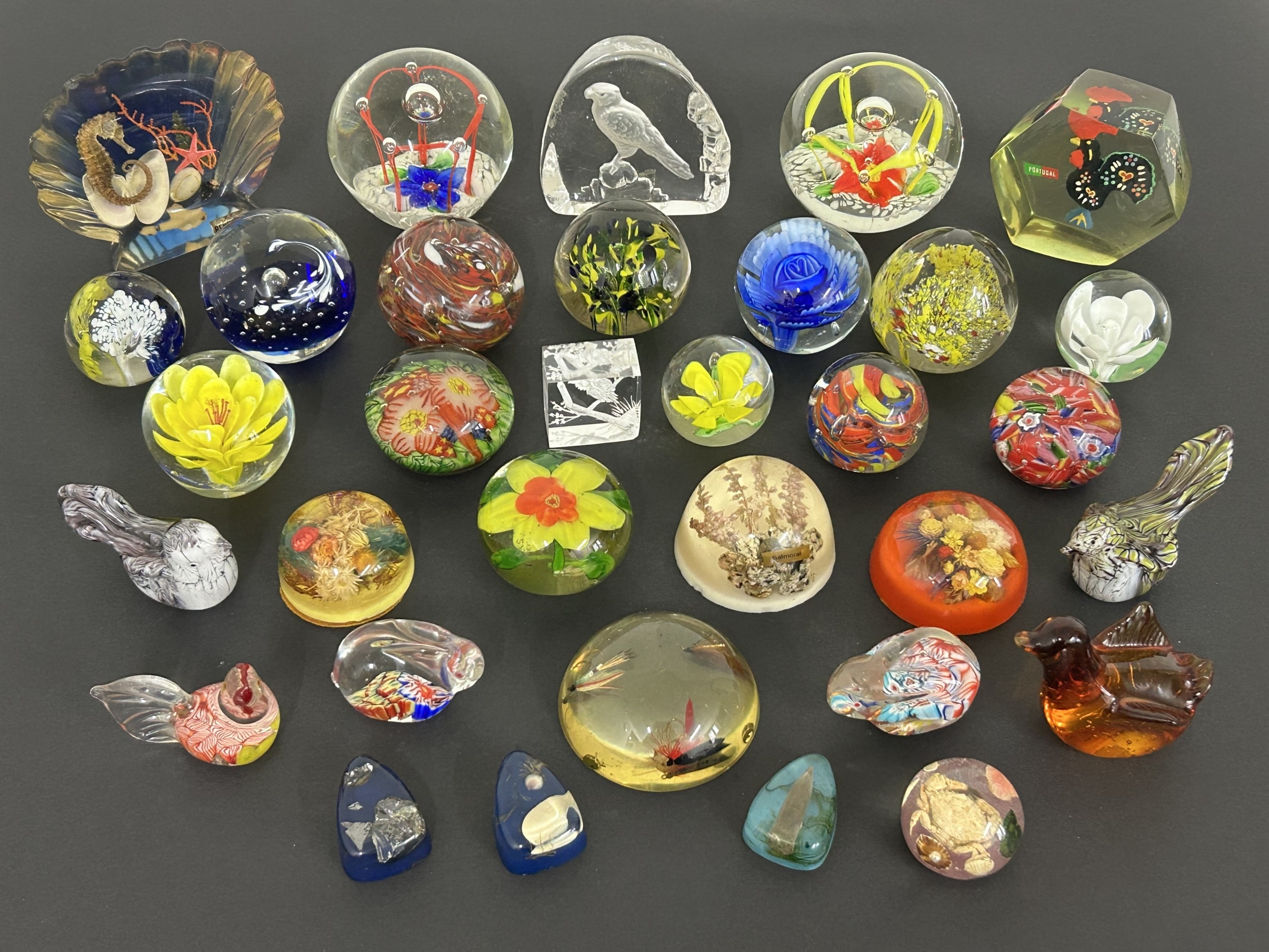 A collection of mixed mainly glass paperweights including a few resin ...