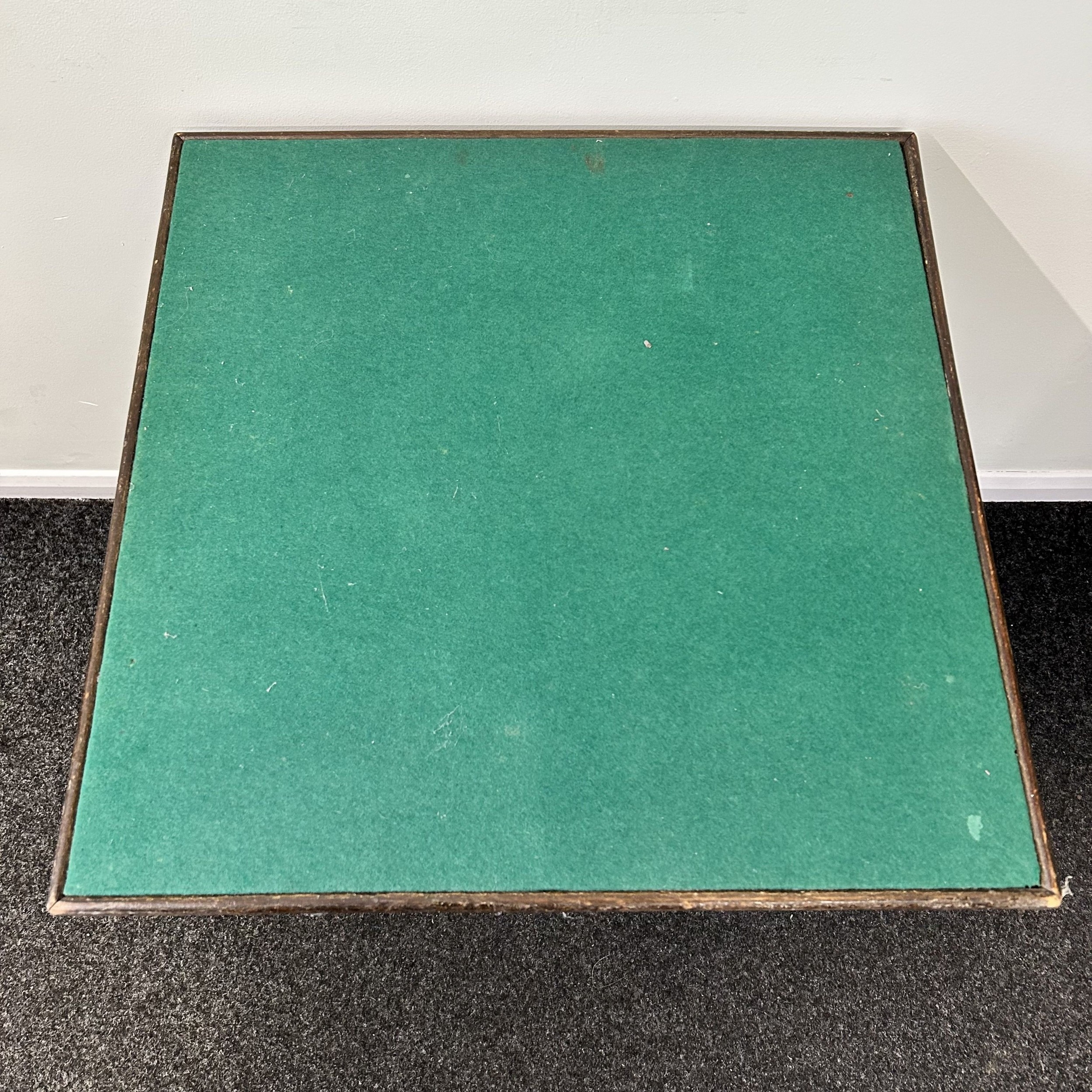A vintage fold-up card table with green baize, 36