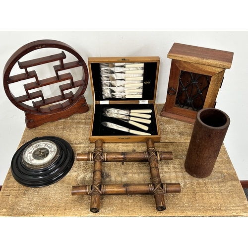 62 - Mixed mainly woodwares including a key press, Oriental miniature display shelves, brush pot, baromet... 