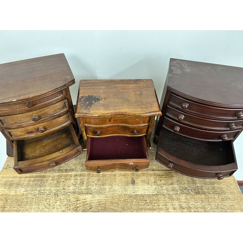 63 - Three small wooden multi drawer jewellery chests, the tallest approx. 9 1/2