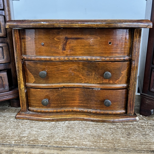 63 - Three small wooden multi drawer jewellery chests, the tallest approx. 9 1/2
