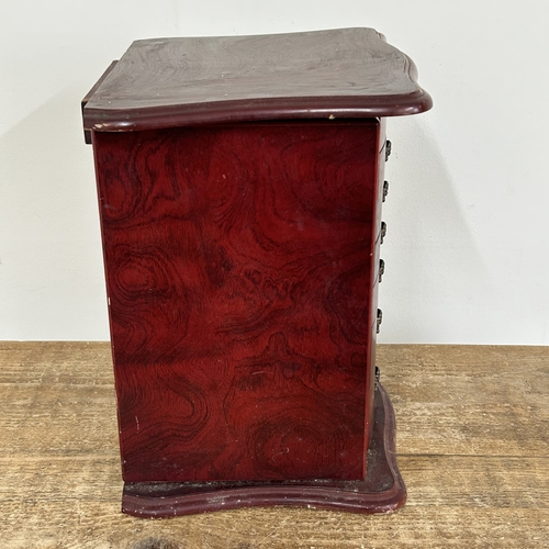 64 - A vintage Oriental style multi drawer jewellery chest with side doors, lift lid and secret drawer lo... 